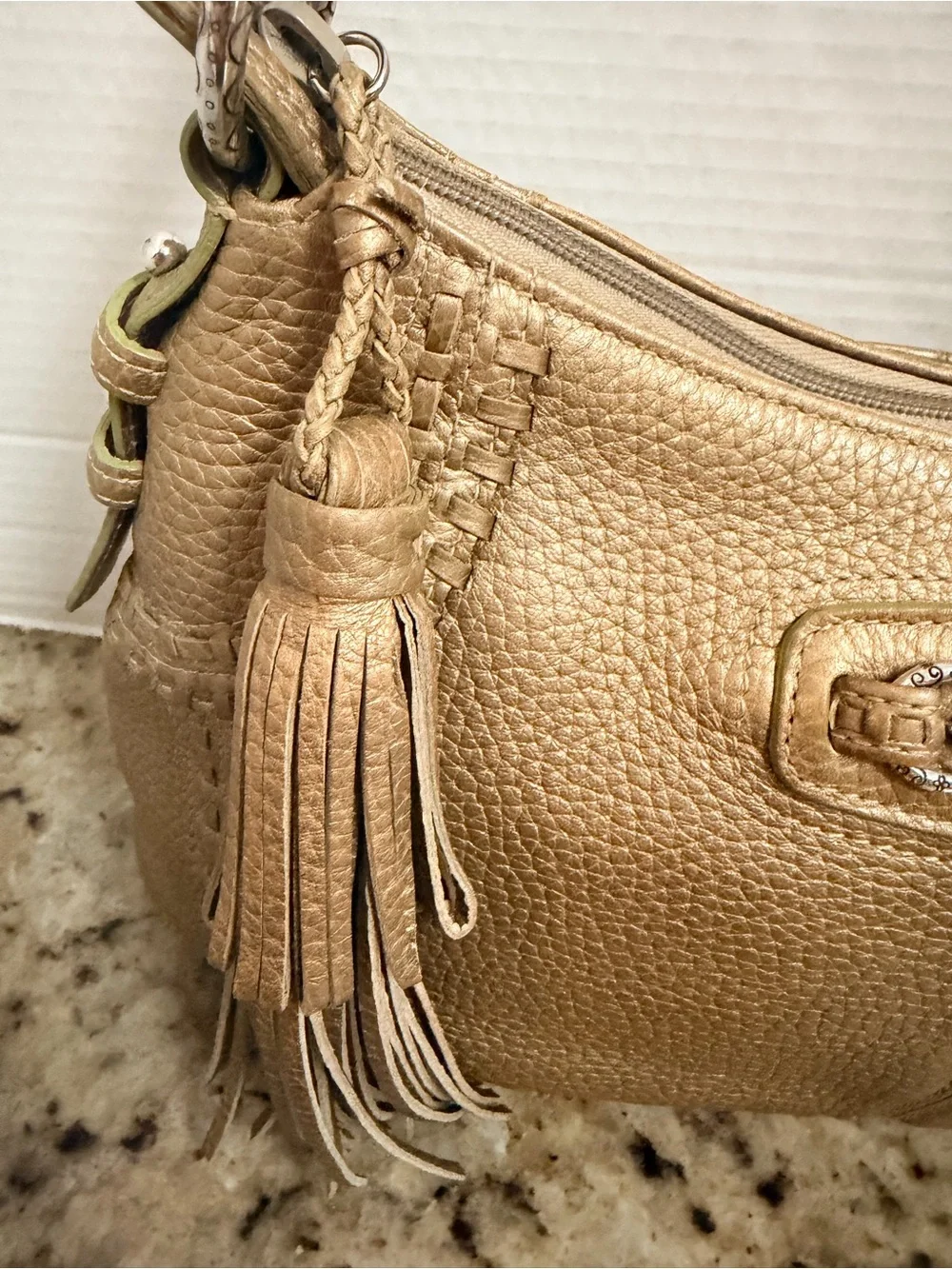Brighton Gold Pebbled Leather Shoulder Bag with Tassel Accent